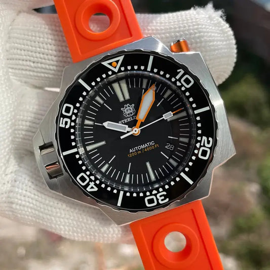 a watch with an orange strap on it